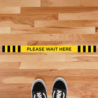 "Please Wait Here" Line Floor Sticker on a Flooring 2 example