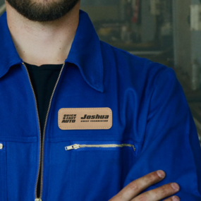 Auto technician with a custom engraved name tag