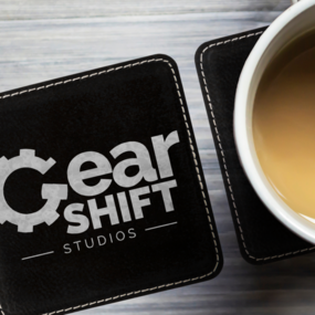 Custom engraved coasters with studio logo