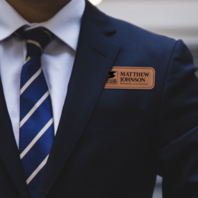 Custom engraved name tag on business man