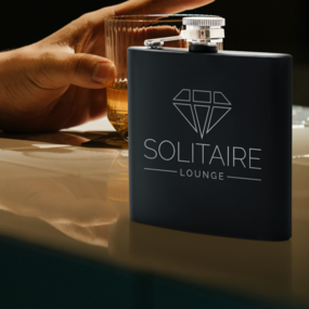 Lounge logo on custom engraved flask