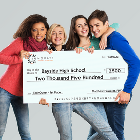 Students Holding Giant Check For 1st Place Prize